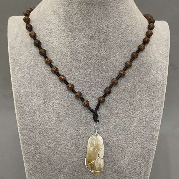 Pendant Citrine Raw Wrapped 38x47x17mm+- on a cord with beads, length 60cm+