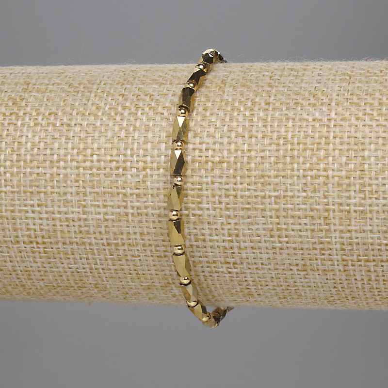 Bracelet with Czech crystal, golden, faceted cylinder 5x3mm±, bead 2mm±, length 18cm stretch