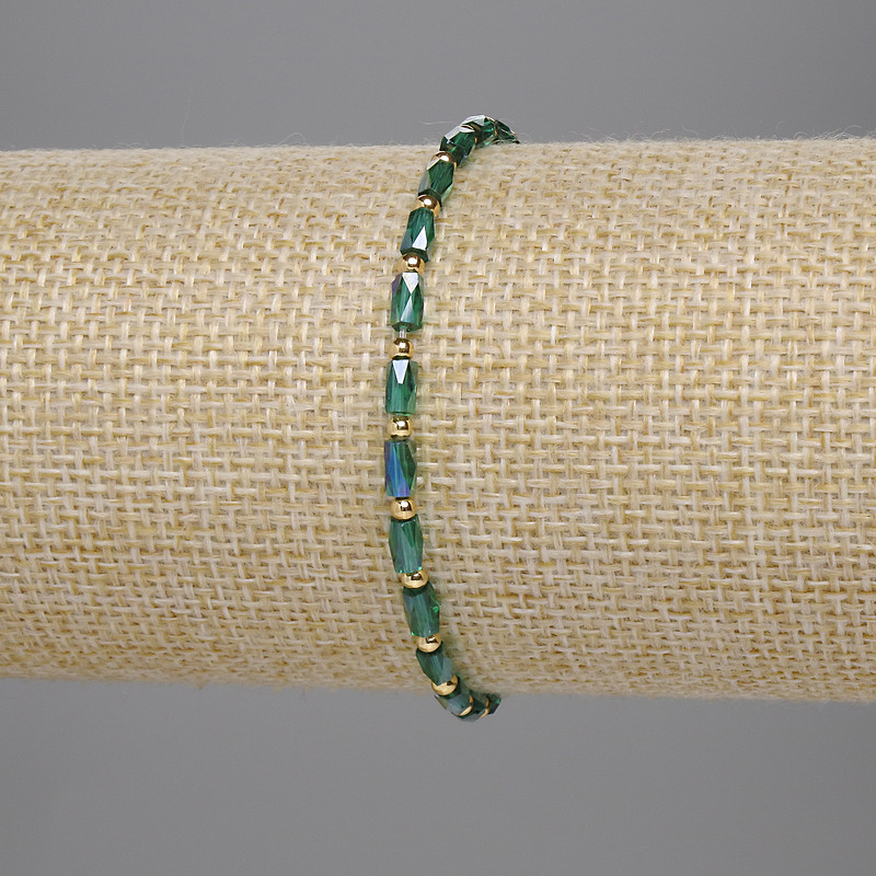 Bracelet Czech crystal green faceted cylinder 5×3mm+- bead 2mm+-, length 18cm stretch