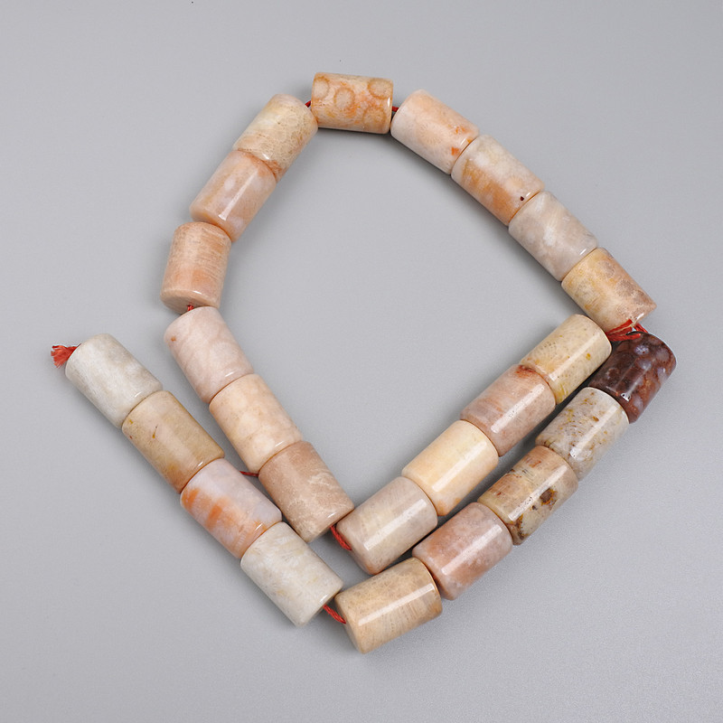 Beads, Scolecite? Wait no. Correction: Skam'yanilyy coral cylinder beads 16x12mm on thread 38cm+