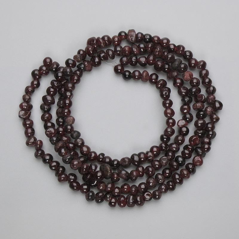 Garnet faceted beads, diameter 5–6.5×4–5 mm, on thread, length 80 cm+
