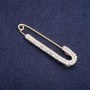 Brooch Pin with White Rhinestones 75x16mm± golden metal