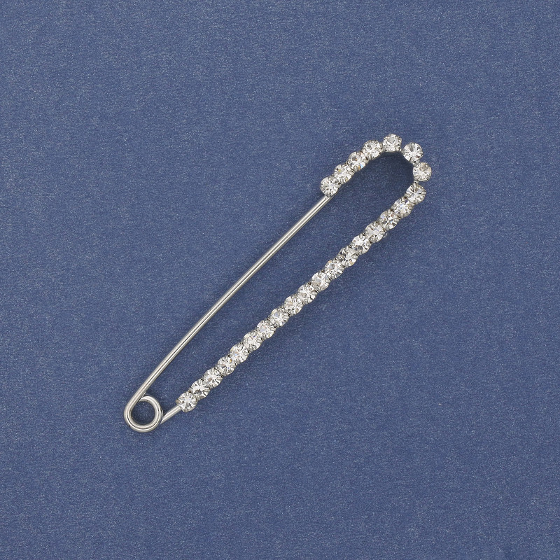 Brooch pin with white rhinestones 56x11mm+- silver metal