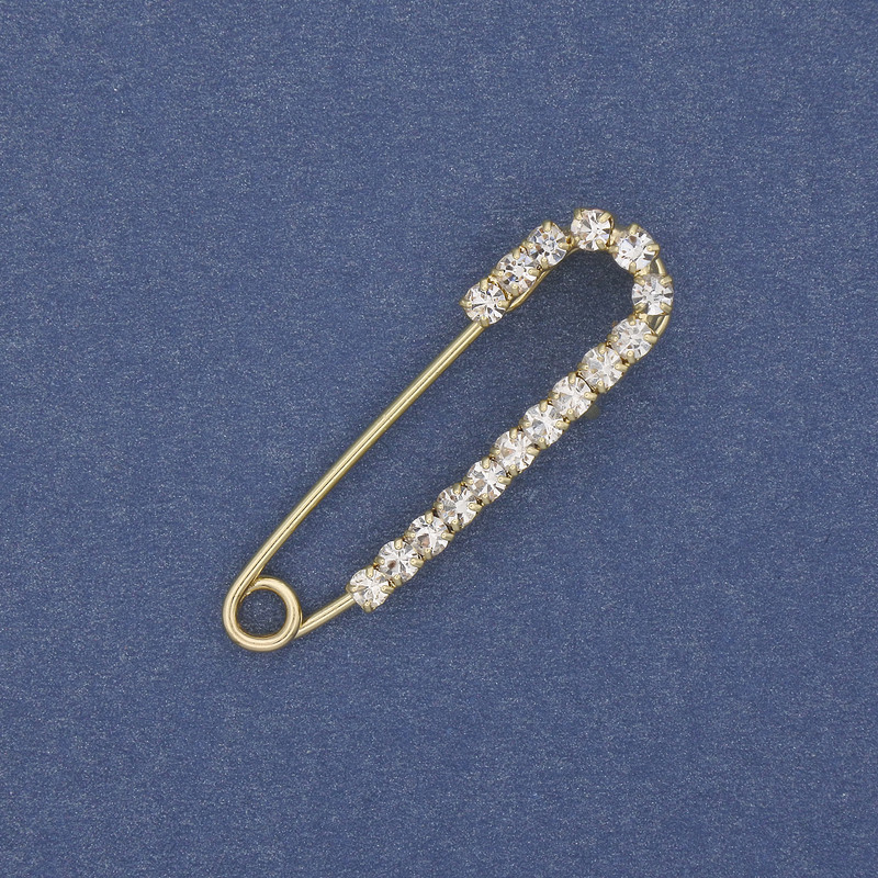 Brooch pin with white rhinestones 36x10mm+- gold-tone metal