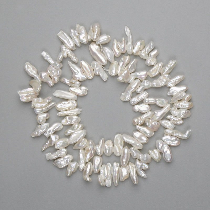 Baroque pearls with a petrol color on a string 7-14×3-7 mm +-, length 38 cm ± on thread