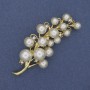 Brooch 'Twig of Mallorca' with rhinestones, golden metal 70x28mm +