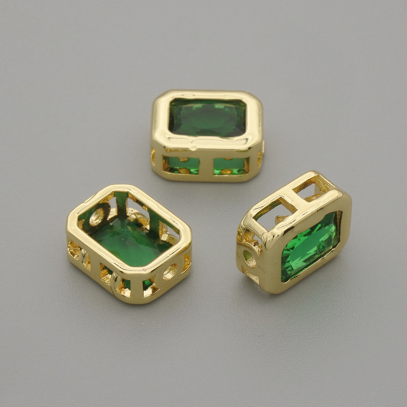 Bead insert with green crystal in gold tone metal, diameter 9x7mm±, hole diameter 1.3mm± per 1 piece +
