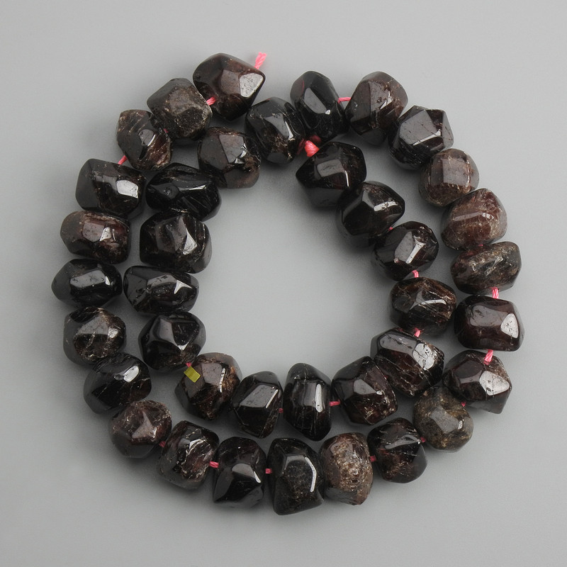 Garnet Beads Multifaceted, diameter 14-15 mm, 5x9-11 mm ±, thread length 39 cm ± with natural imperfections