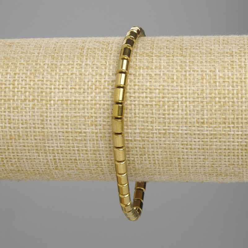 Bracelet Hematite cylinder 5x4mm+- gold color, length 18cm+- stretch