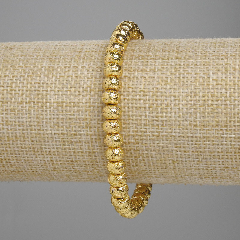 Lava bracelet with a gold-toned metal finish porous roundel 6x4, 5mm+- , length 18cm+- stretch