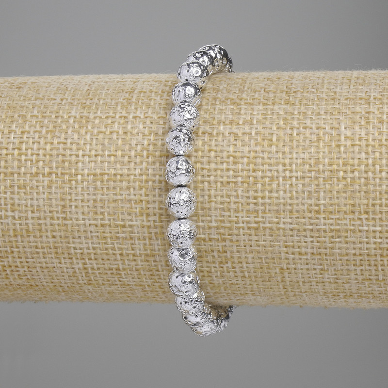 Lava bracelet with a silver-toned metal coating, porous bead 6.5 mm+-, length 18 cm+- stretch