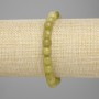 Bracelet Chrysolite Olivine faceted bead, diameter 7.5 mm +/-, length 18 cm +/- stretch