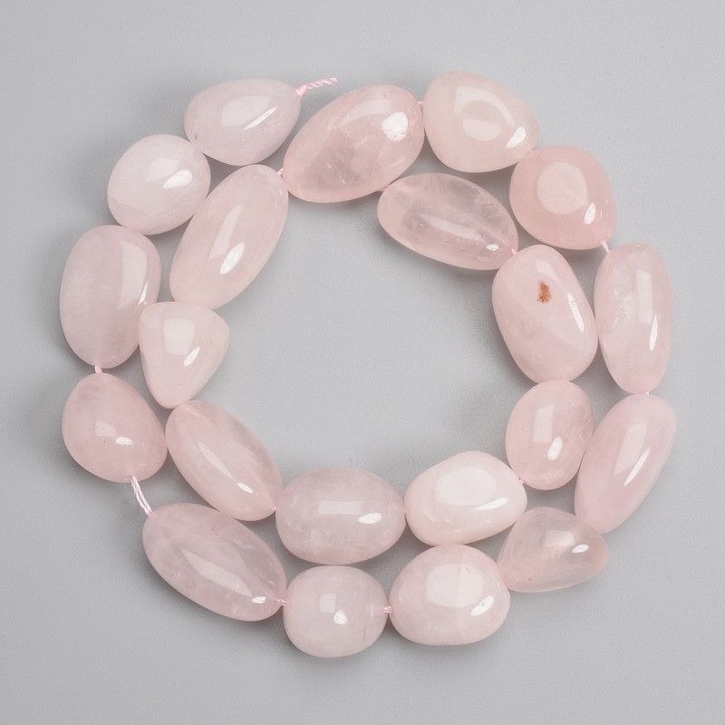 Pink quartz tumbled beads 15–24×13–15 mm +/-, length 38 cm +/- on a string