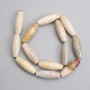 Fossilized coral beads, elongated oval 30×10mm ±, length 38cm ± on a string