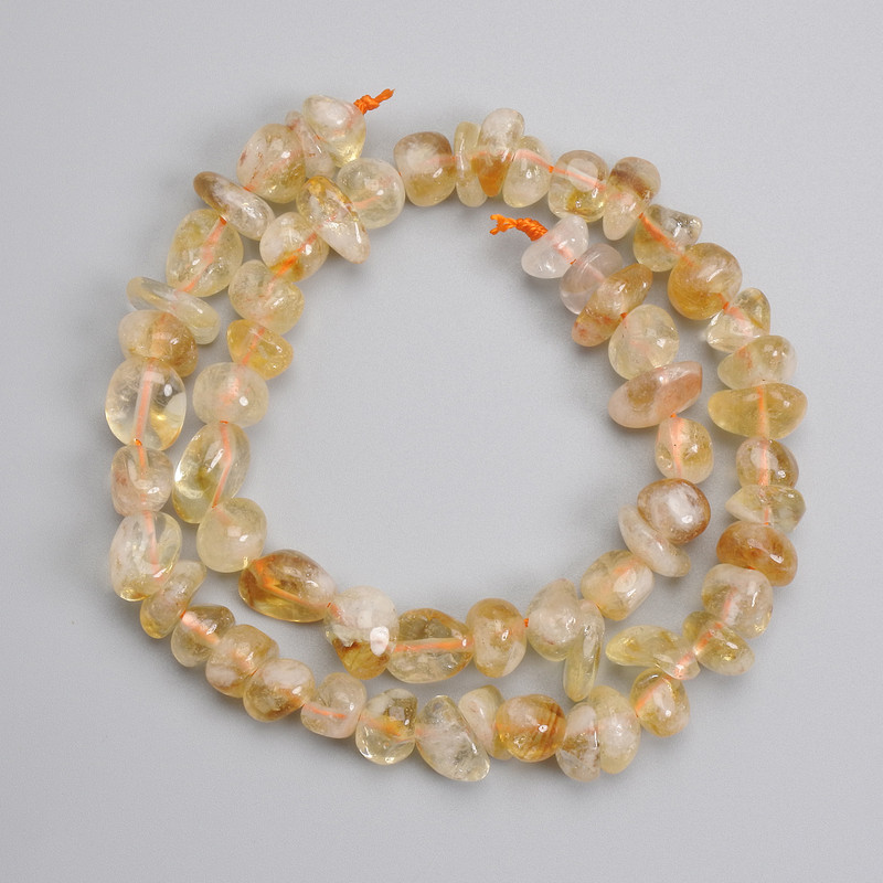 Citrine tumbled beads 8-14x4-10.5 mm+-, length 39 cm+- on a string