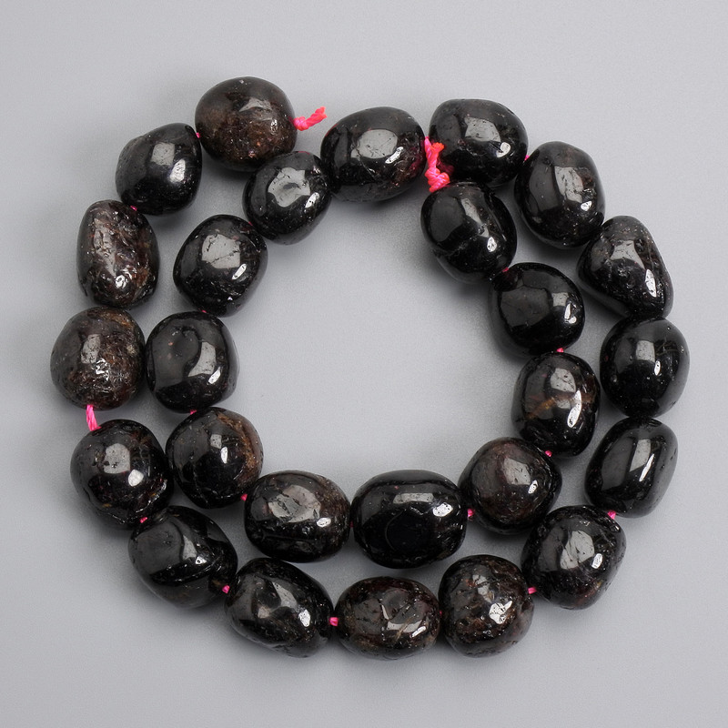 Garnet beads tumbled 15-18x11-13mm +-, length 38cm +- on a thread