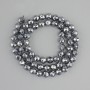 Terahertz beads faceted, diameter 6mm+- , length 39cm+- on a thread