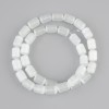 White Cat's Eye cylinder beads, diameter 10, 5x8mm +/-, length 37cm +/- on a thread