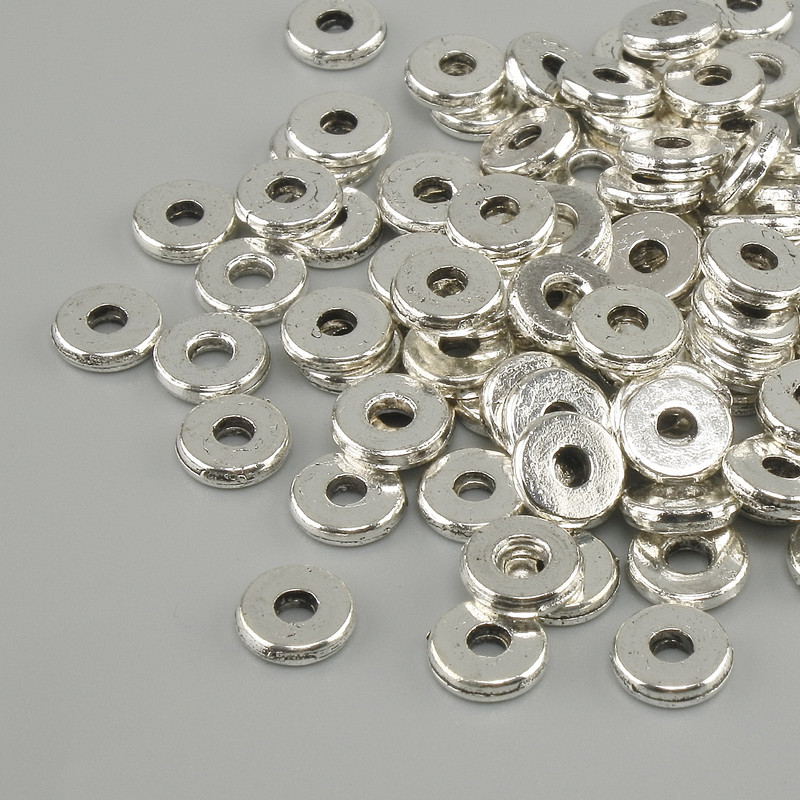 Silver-colored bead-insert metal color silver, diameter 6 mm +- hole, diameter 2.5 mm +- packaged 20 g (~100 pcs)