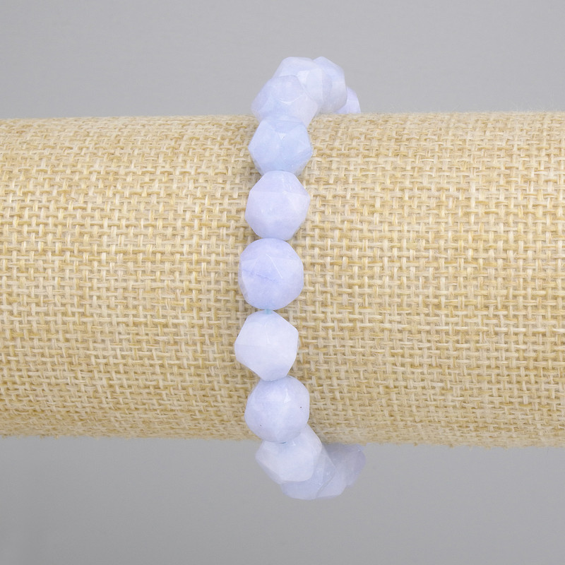 Aquamarine bracelet faceted shapes, diameter 10x9 mm +/-, length 18 cm +/- stretch
