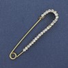 White rhinestone stick pin brooch 72x17mm ± gold-colored metal