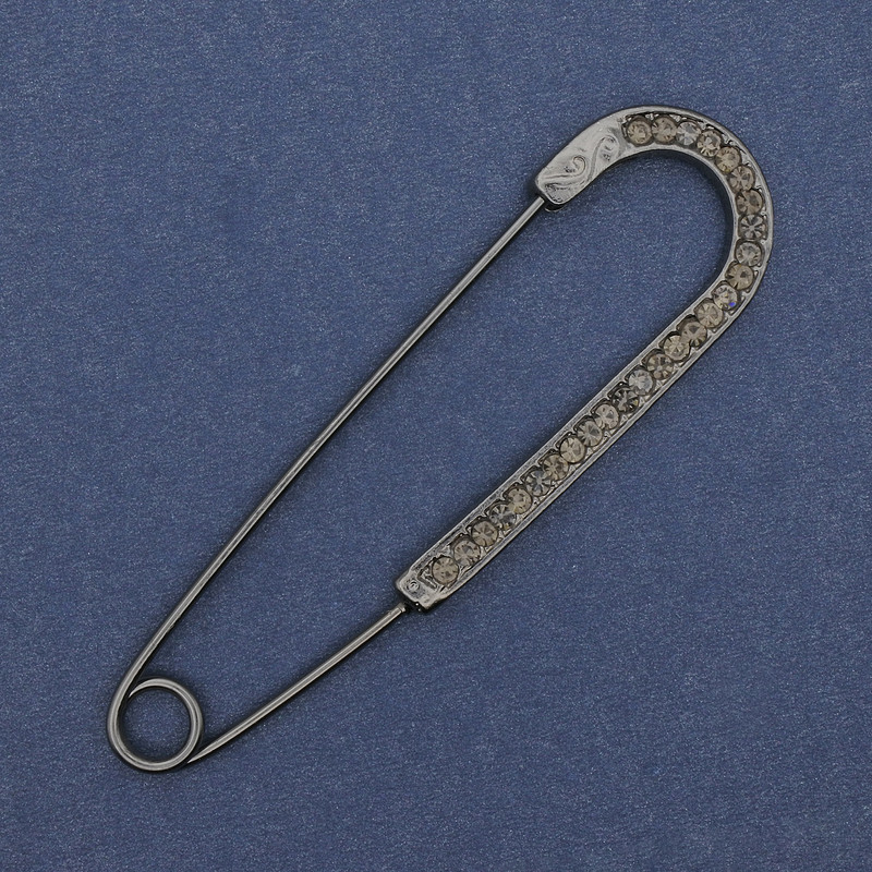 Brooch pin with gray rhinestones 68x19mm ± dark silver-colored metal