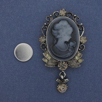 Cameo brooch on a magnet Lady, rhinestones, silvery metal 85x35 mm +