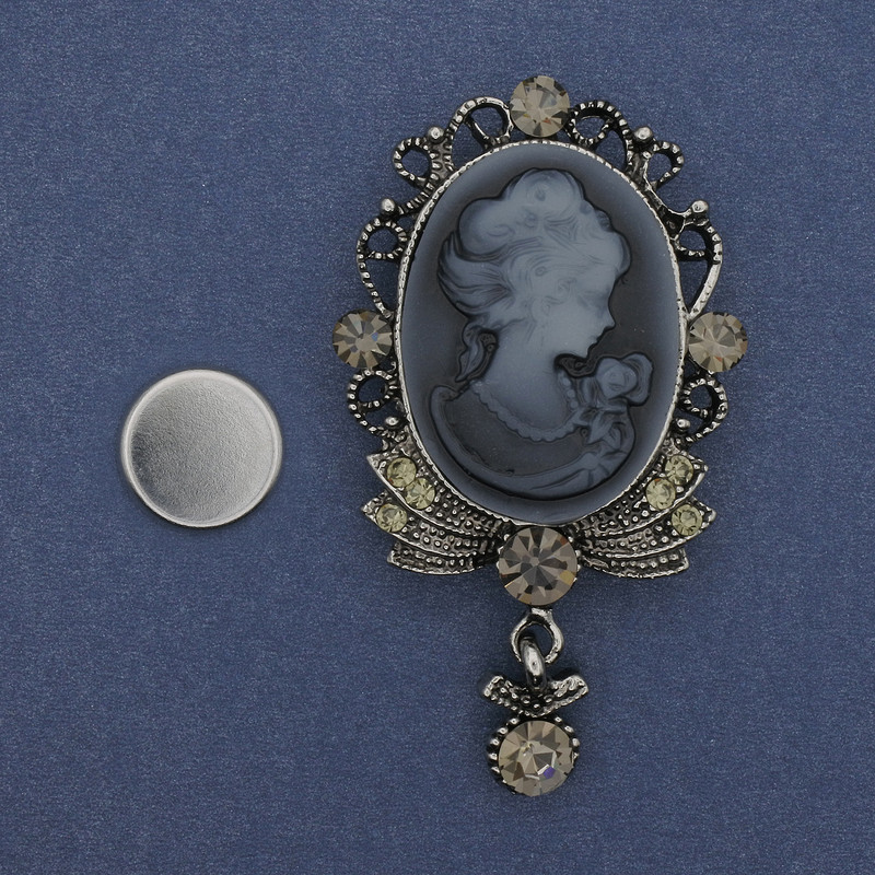 Cameo brooch on a magnet Lady, rhinestones, silvery metal 85x35 mm +