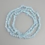 Aquamarine tumbled chips beads, diameter 4-9x2-4mm +/-, length 76cm +/-, on a nylon thread