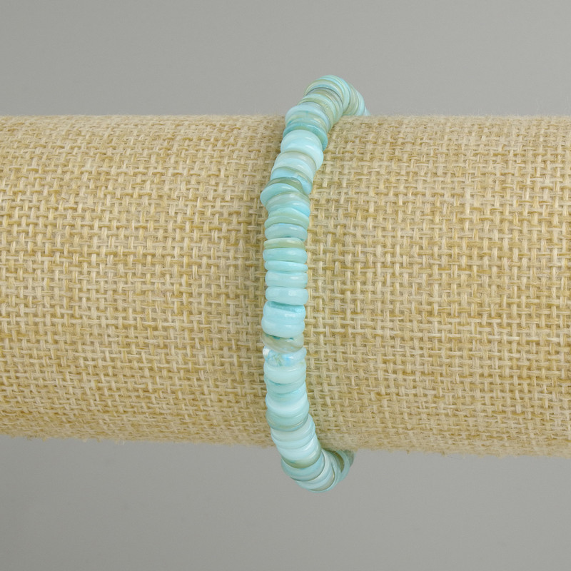 Bracelet with scapharca shell scallop rondelle, diameter 6x2mm +- , length 18cm +- stretch