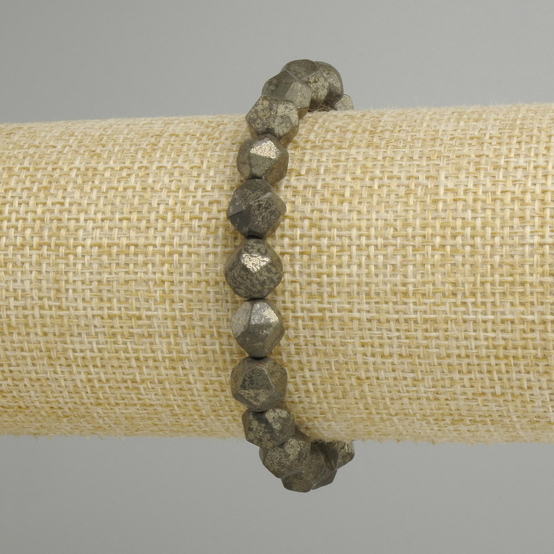 Pyrite bracelet faceted, diameter 8x7mm +/-, length 18cm +/- stretch