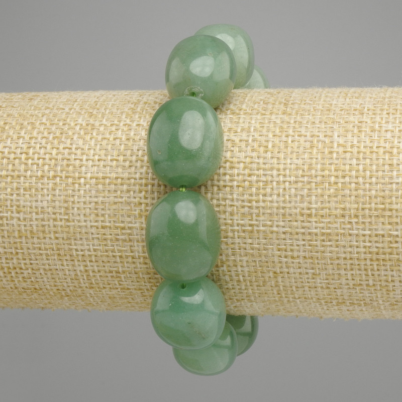 Jade bracelet tumbled oval, diameter 20x15mm +/-, length 18cm +/- stretch