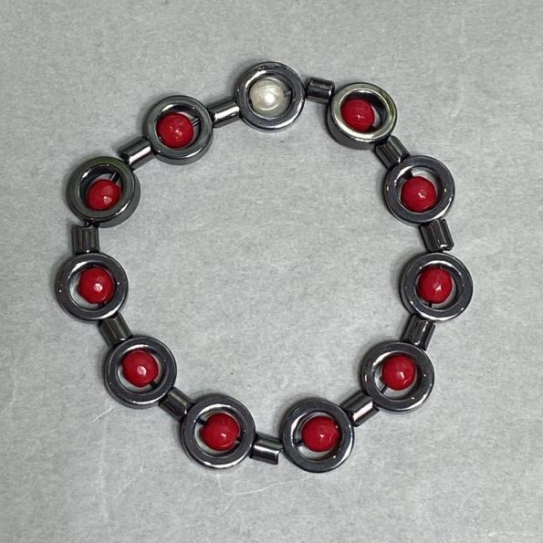 Bracelet Coral faceted bead 5mm± Hematite circle 12mm± length 18cm± stretch