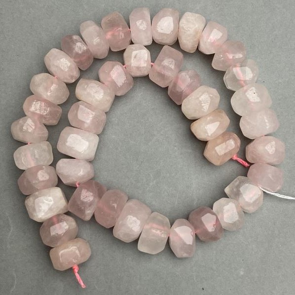 Pink quartz beads faceted, diameter 14-15x9-11mm ±, length 39cm ± on a string