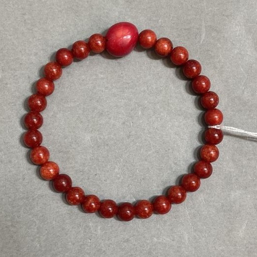 Coral bracelet smooth round bead 8mm+- tumbled 11x10mm+-, length 18cm +- stretch