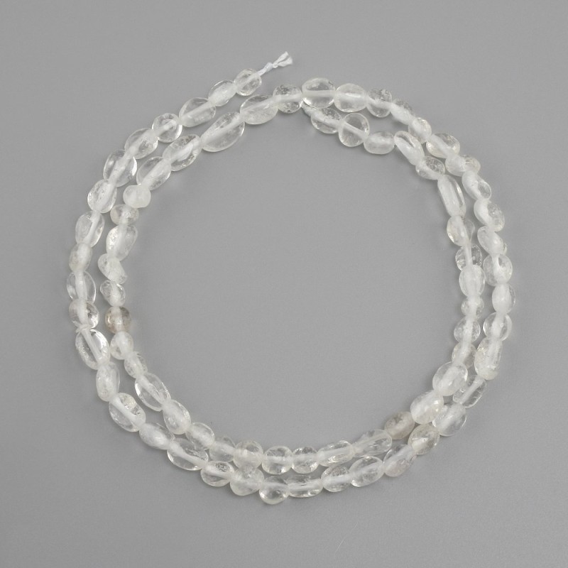 Beads Rock Crystal tumbled, diameter 5–7x4–5mm +/-, length 39cm +/-