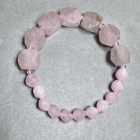 Bracelet Rose Quartz multi-faceted pieces, diameter 12x10mm +- 8x7mm+-, length 18cm +- stretch