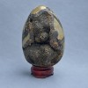 Souvenir egg natural stone Septaria, diameter 120x88 mm ± weight 1134 g. on a stand
