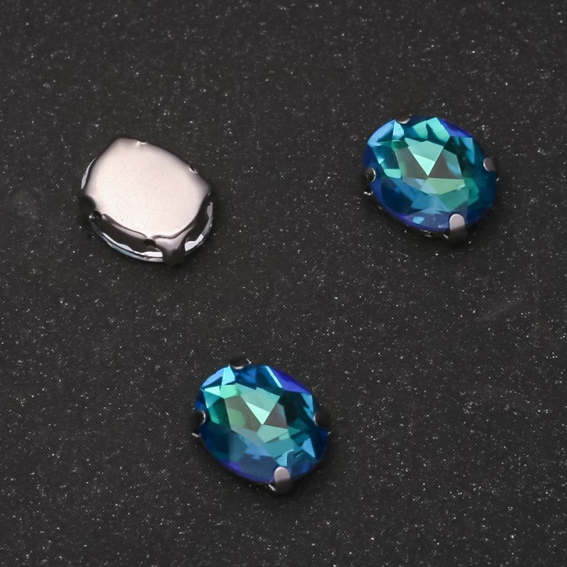Price per pack /10 pcs. Sew-on crystal in claw setting Oval 8x10mm green-blue