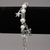 Bracelet on Elastic Band with River Pearls, Silver-Tone Inserts and Charms, diameter 8-10mm+/-, length 18cm+