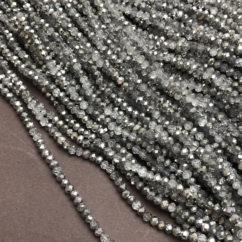 Beads on thread - Czech Crystal light gray assorted, transparent with faceted rondelle pattern, diameter 3×2.5 mm ±, length 36 cm ±