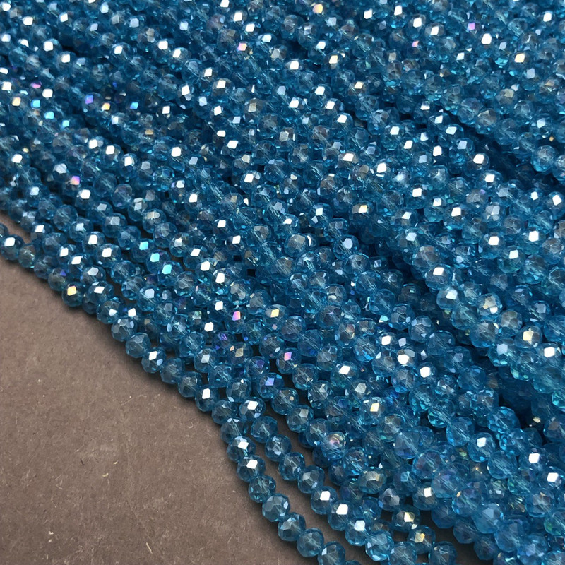 Beads Czech Crystal on wire blue-green transparent with gasoline drilled rondelle, diameter 3.5×3 mm ±, length 36–38 cm ±