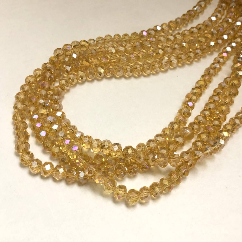 Beads Czech Glass Crystal on a Thread Orange-Peach Transparent with Gasoline Glint, faceted rondelle, 6x4.5 mm + -, length 38-40 cm