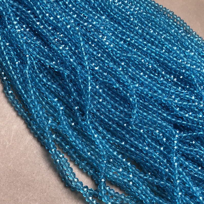Beads Czech Crystal blue-green transparent faceted rondelle on thread, diameter 3.5x3mm +-, length 36-38cm +