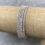 Spiral bracelet with five turns, small white crystals, 18-22 cm circumference