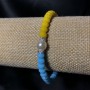 Bracelet on elastic with Czech crystal + acrylic Ukraine, faceted rondel, diameter 6×4mm, length 18cm