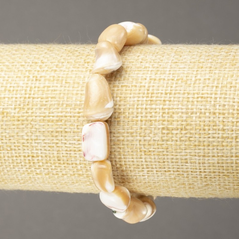Bracelet on elastic with natural beige mother-of-pearl, faceted beads, diameter 17x9mm+