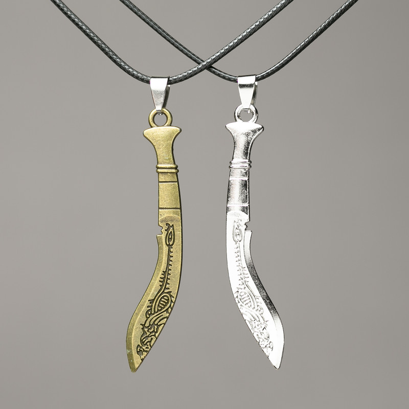 Pair Machete Pendants on Cord 75x14mm + -, length 45-50cm