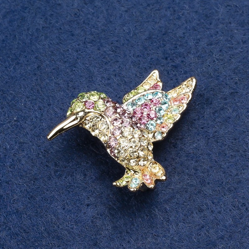 Brooch Colibri with golden metal and rhinestones 25x33mm +