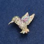 Brooch Colibri with golden metal and rhinestones 25x33mm +